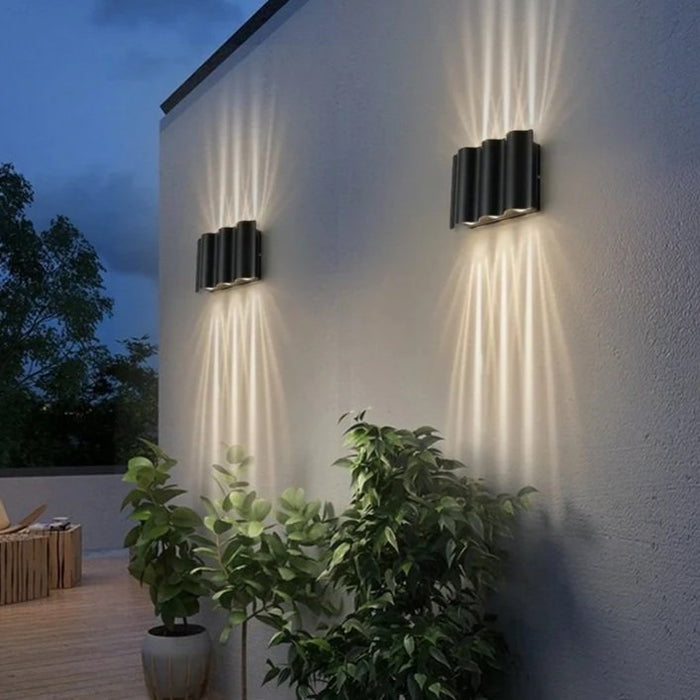 The Virello LED Outdoor Wall Light pair casting up and down light on an exterior wall