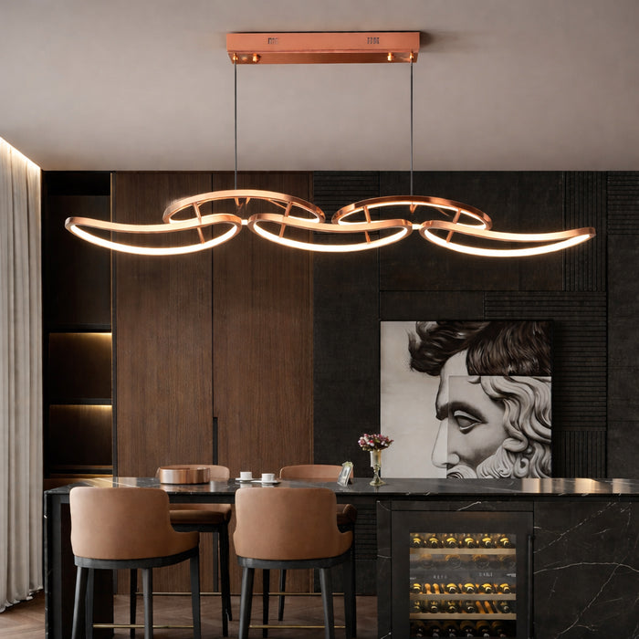 Seraphine Arc LED Pendant Light in rose gold above a dining table