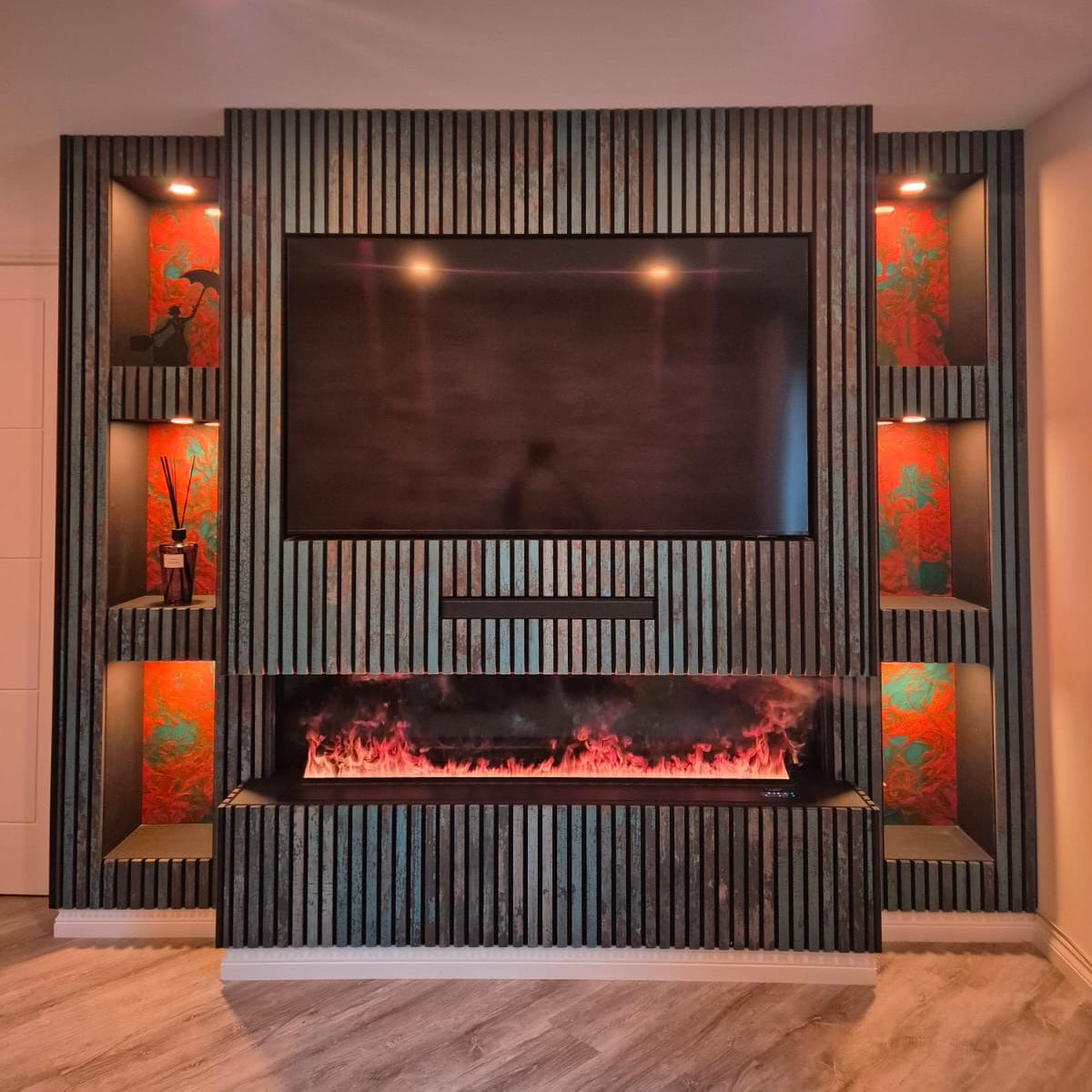 Luxe Water Vapour Fireplace set into a media wall below a TV