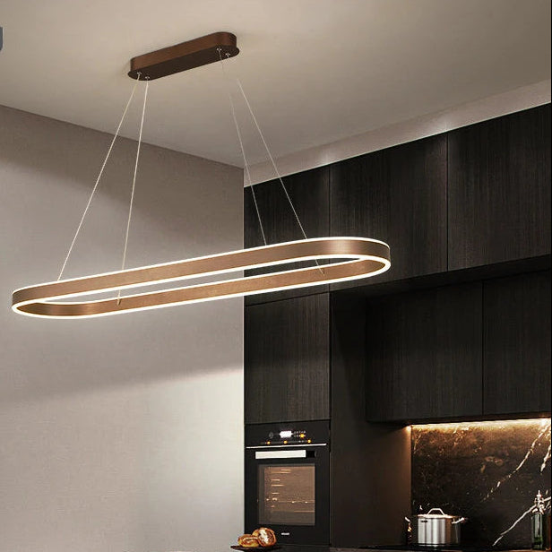 Modern kitchen with a pendant light and Kagu branding.