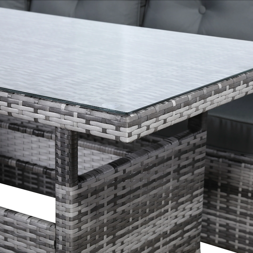 Devon Corner Dining Sofa Set – close-up of the tempered glass-top dining table with woven grey rattan base