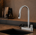 The Belgravia Pull-Out Kitchen Mixer Tap in Brushed Nickel with gooseneck spout, installed on a kitchen sink countertop