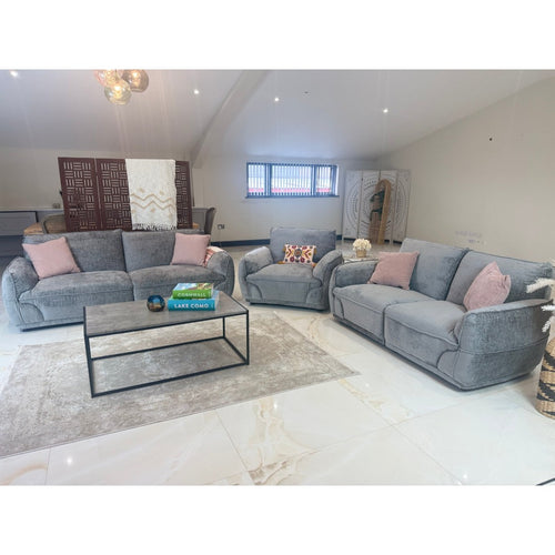 Grey Bergamo 3 seater and 2 seater fabric sofas with high backs and padded arms in an open-plan lounge