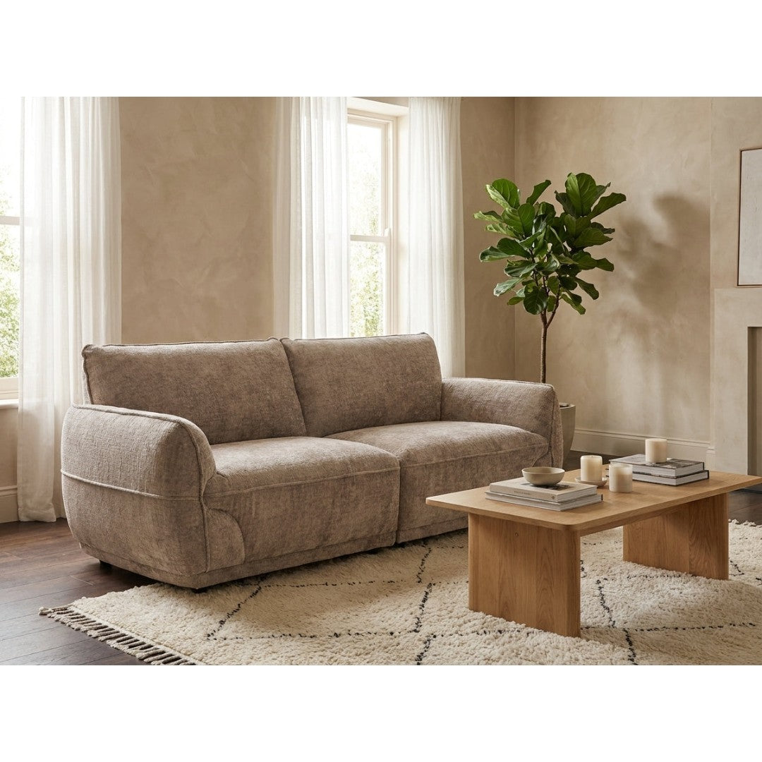 Bergamo 3 seater sofa in beige soft-touch fabric in a warm, modern living room