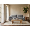 Bergamo 3 seater sofa in grey soft-touch fabric, styled in a bright living room with an oak coffee table