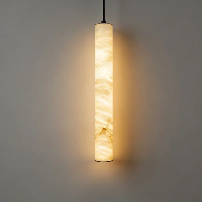 Calacatta natural marble LED pendant light glowing warm white against a grey wall