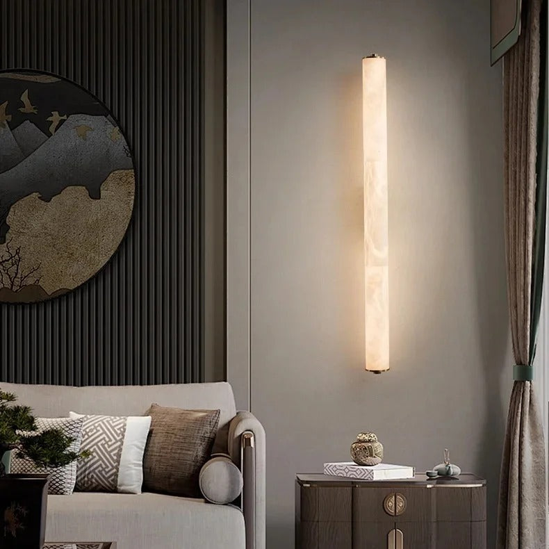 Calacatta marble wall sconce lighting a contemporary living room wall
