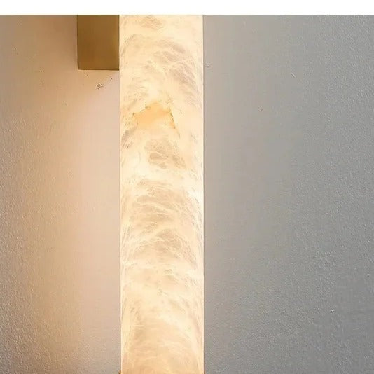 Close-up of the natural marble shade veining on the Calacatta wall light