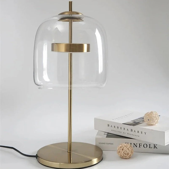 The Clear Dome table lamp with clear glass dome and gold stem