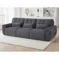 Cortina 3 seater electric sofa bed in grey textured fabric with quilted tufting, styled in a bright living room