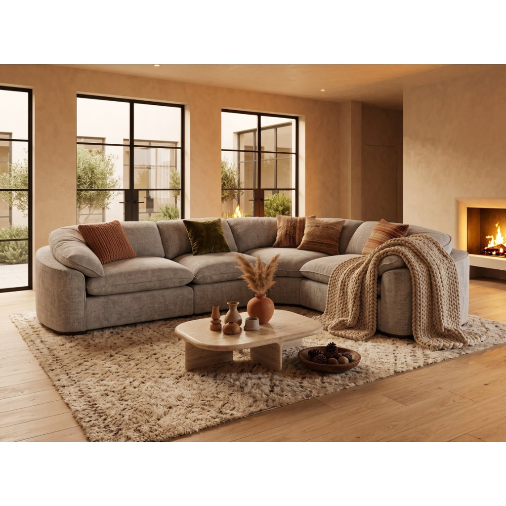 Grey Helena modular corner sofa styled with throw and scatter cushions beside a fireplace