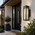 Lucerna crystal outdoor wall light in black beside a modern front door on a rendered house