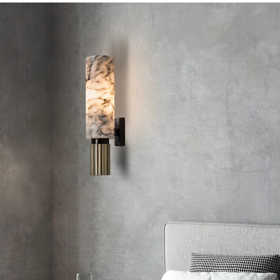 Marmora marble wall light above a bed on a grey plaster wall