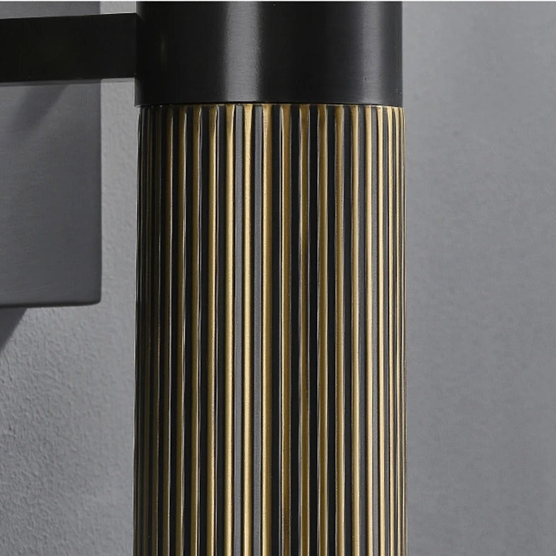 Close-up of the Marmora's fluted brass-tone body and black wall plate