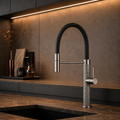 The Marylebone Pull-Out Kitchen Mixer Tap in Brushed Grey with textured knurled base, installed on a kitchen sink countertop