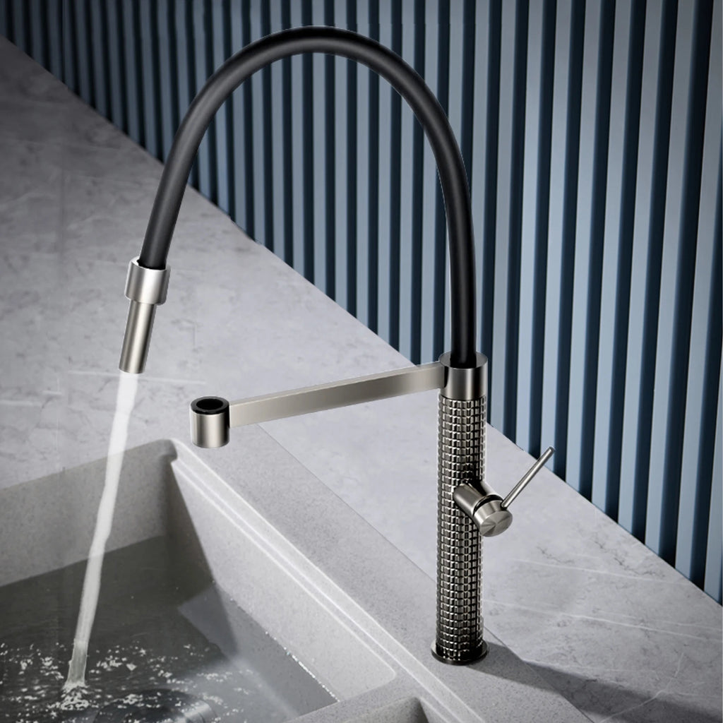 The Marylebone Pull-Out Kitchen Mixer Tap with flexible spout dispensing water into a kitchen sink