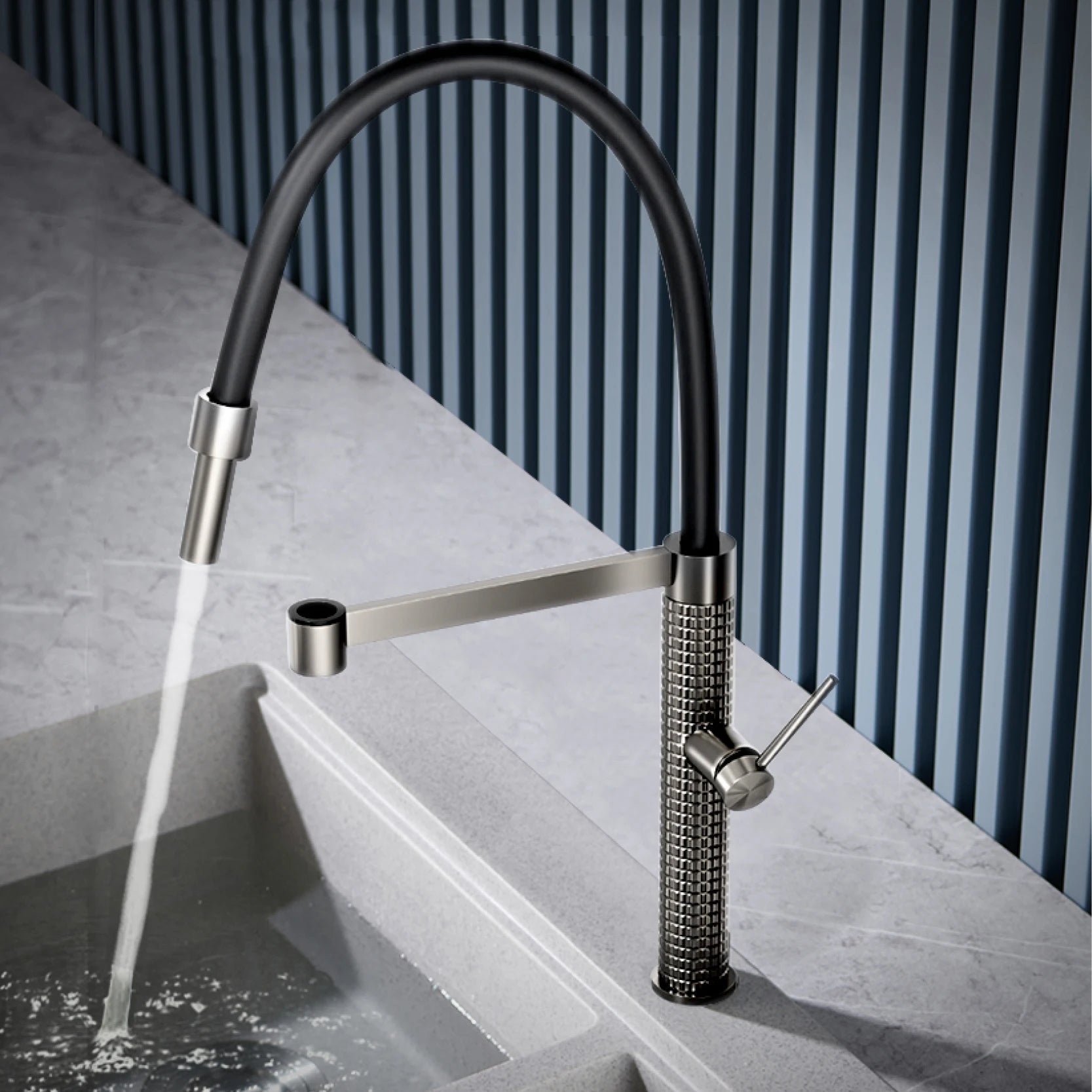 The Marylebone Pull-Out Kitchen Mixer Tap with flexible spout dispensing water into a kitchen sink