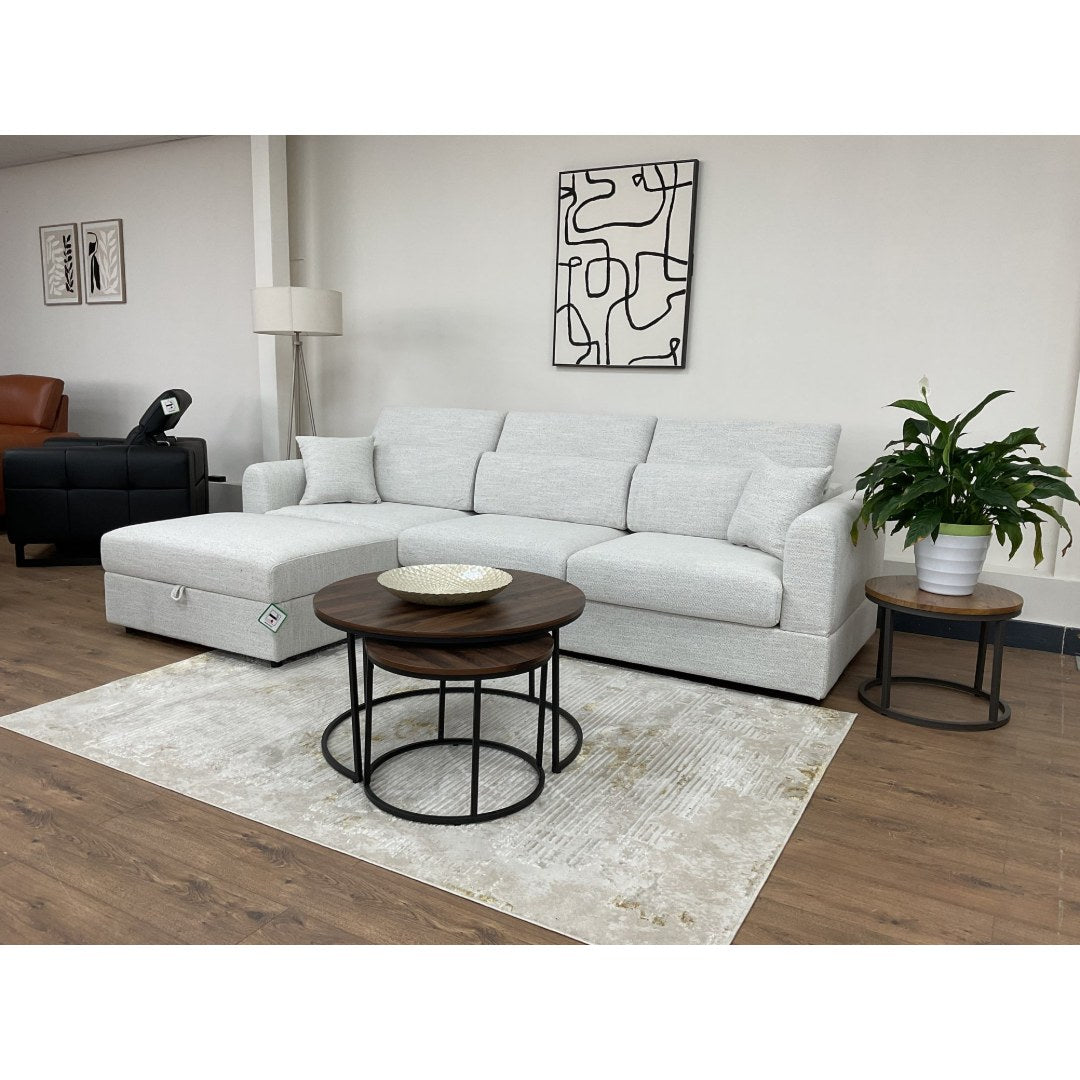 Beige Milano L-shape sofa styled with nesting coffee tables and a rug