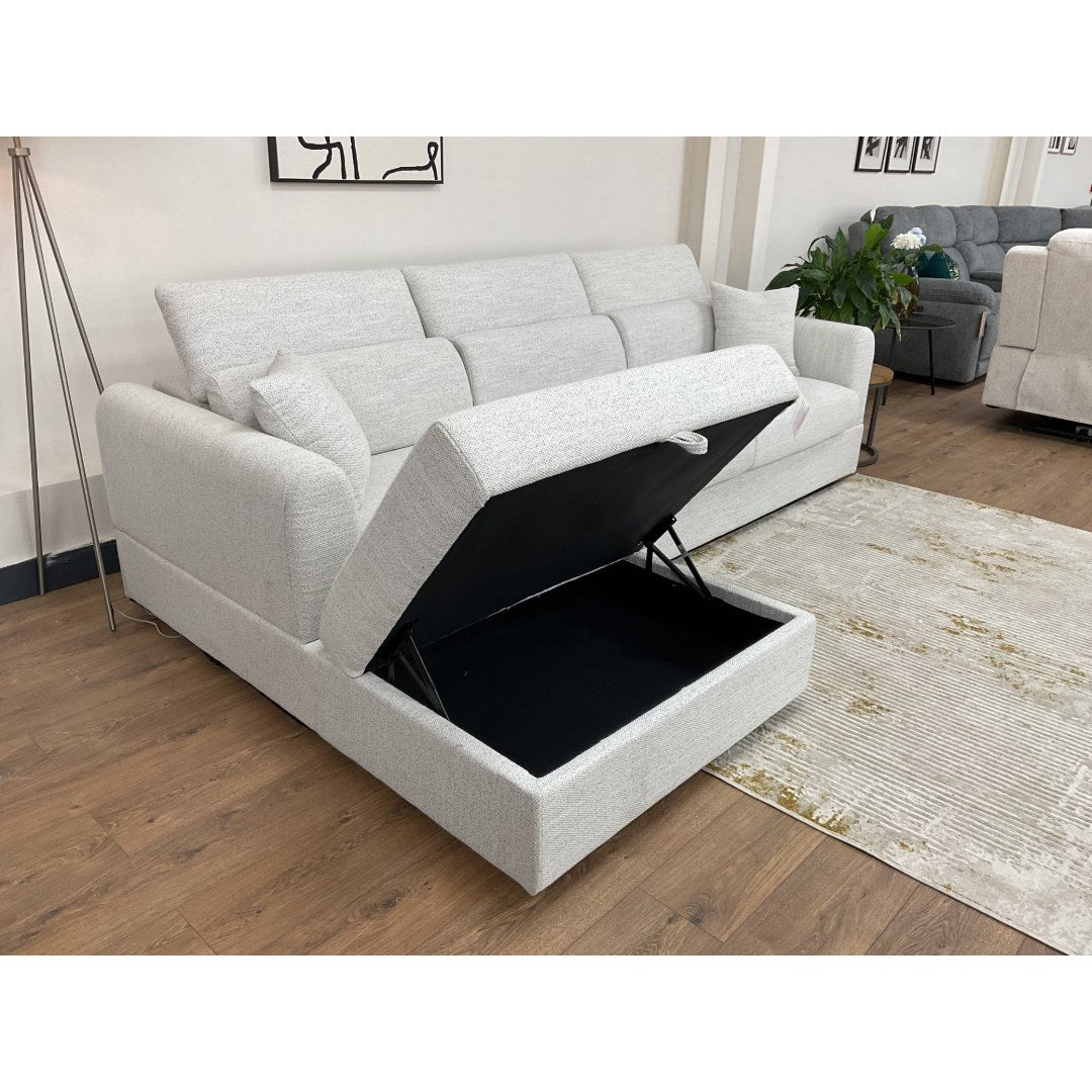 Close-up of the beige Milano chaise lifted to reveal deep storage