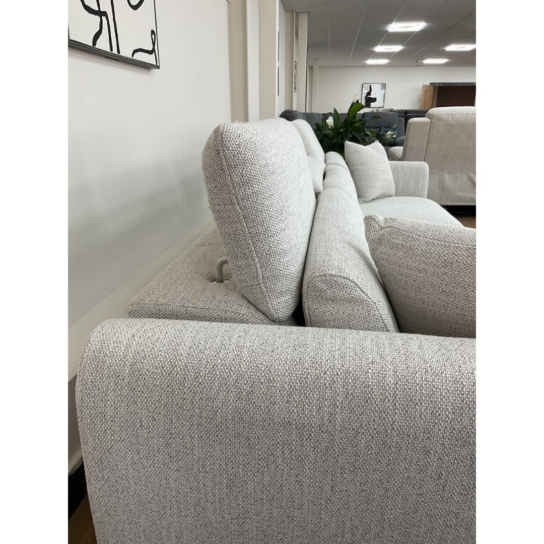 Close-up of the beige Milano sofa headrest and textured weave fabric