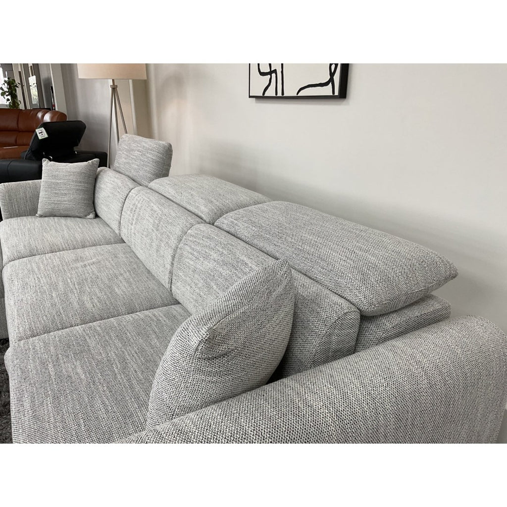 Grey Milano sofa seats with headrest raised and matching scatter cushion