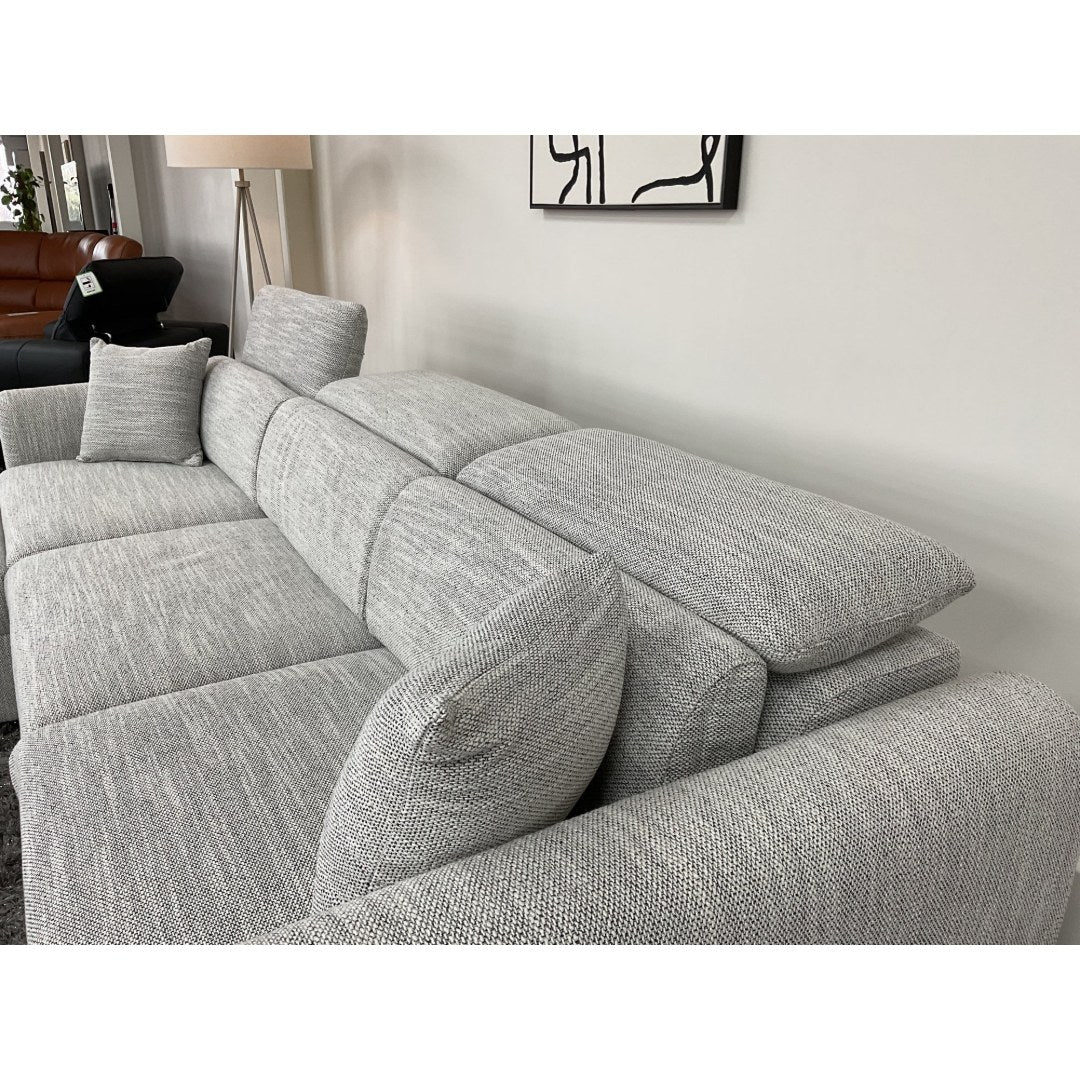 Grey Milano sofa seats with headrest raised and matching scatter cushion