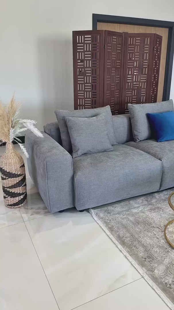 Taormina L-shape modular corner sofa video showing the deep cushions, scatter pillows and soft textured fabric