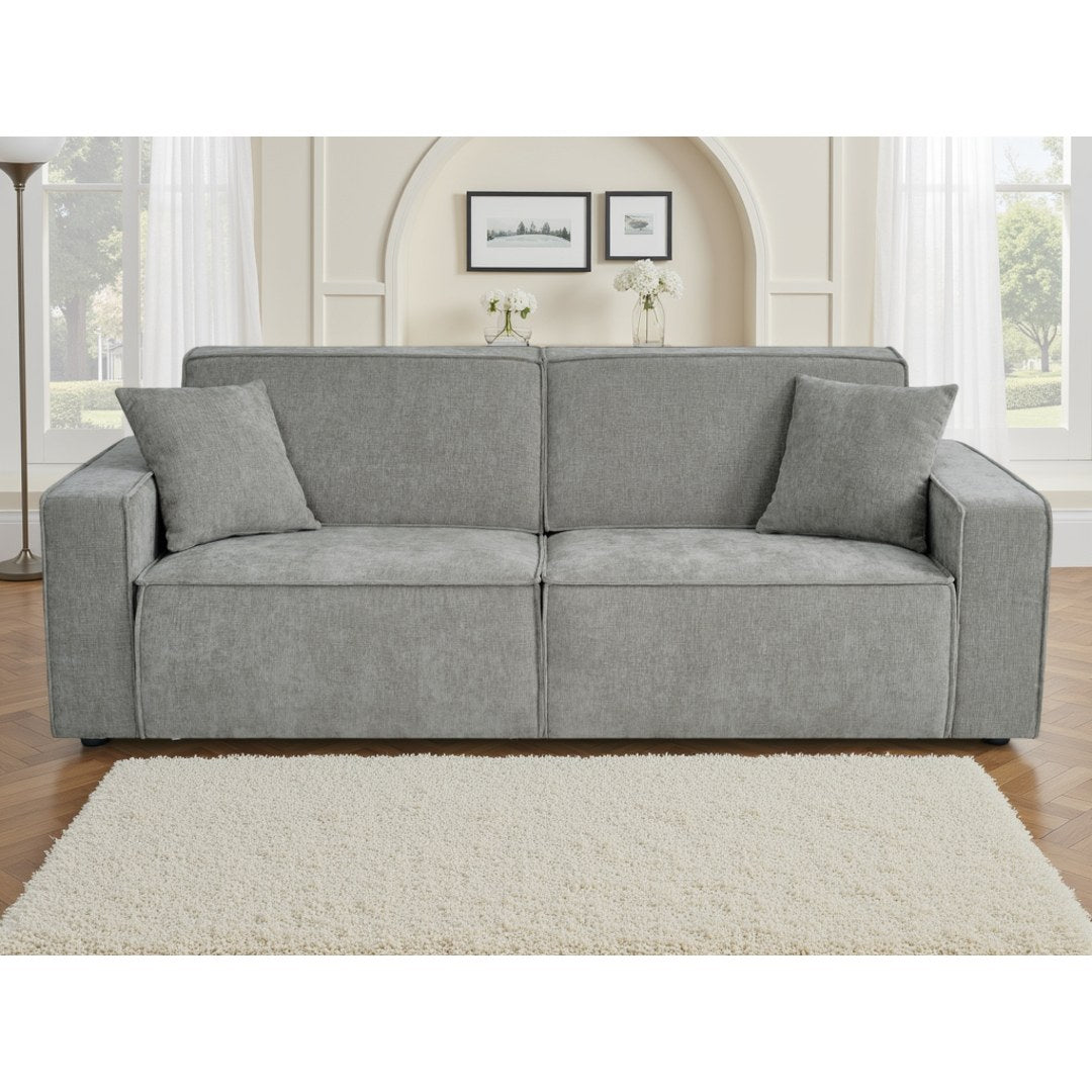 Front view of the grey Siena electric sofa bed with two matching cushions in a bright living room